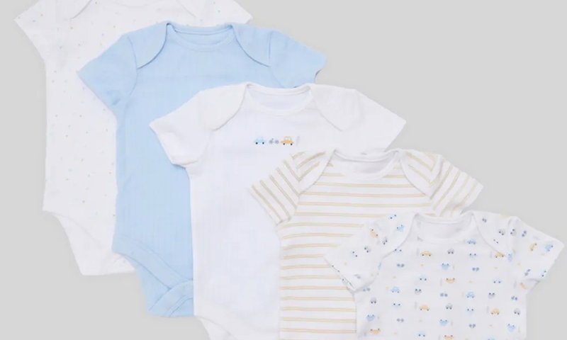 Five baby onesies in soft pastels, including blue, white, and striped patterns, featuring playful designs and soft cotton fabric.