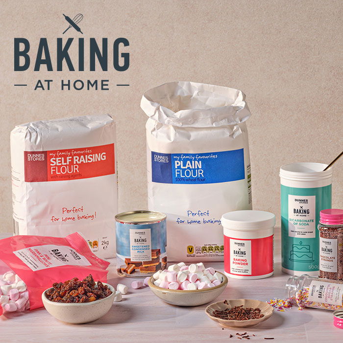 Dunnes Stores Plain flour, marshamallows, sprinkles, grund almonds, on a beige background