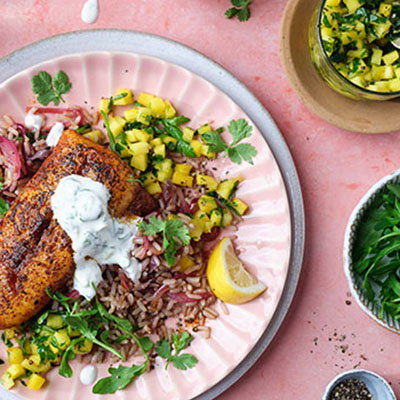 Spiced Hake with Brown Rice, Mango Salsa & Creamy Coriander and Lime Dressing.