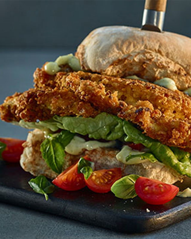 Crispy buttermilk chicken burger with lettuce in a toasted bun
