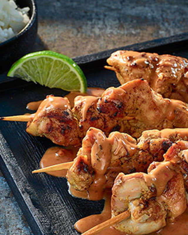 Grilled chicken satay skewers served with dipping sauce