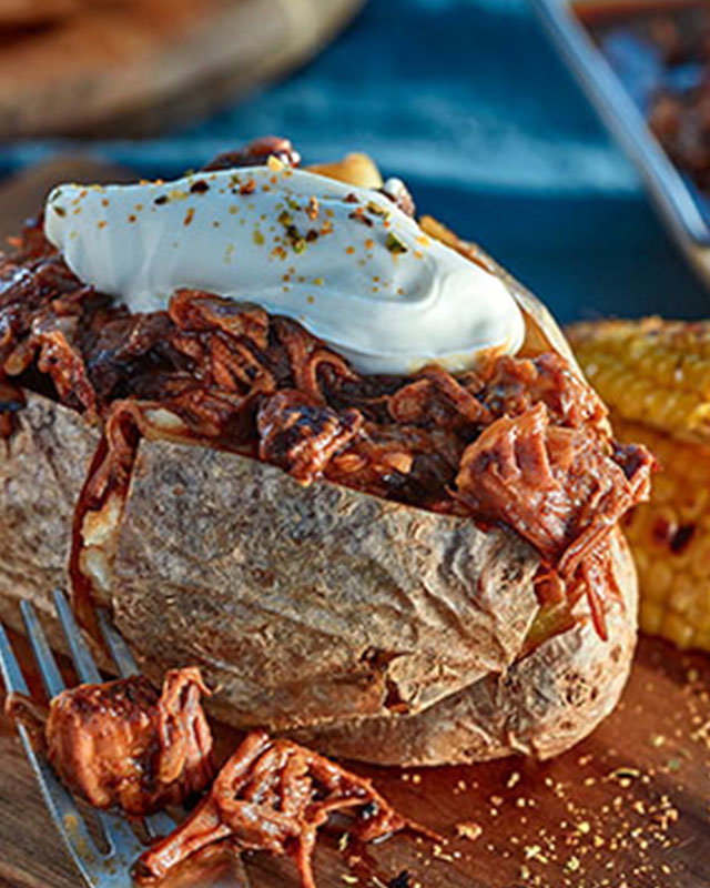 Sweet and smoky barbecue beef short ribs with garnish