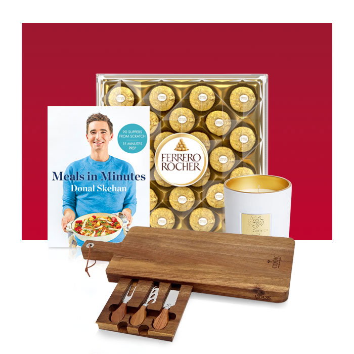 Christmas gift ideas including a cookbook, Ferrero Rocher chocolates, scented candle and wooden cheeseboard set.