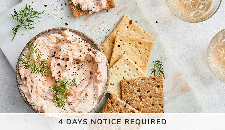 A bowl of creamy p&acirc;t&eacute; garnished with fresh dill, served with assorted crackers and wine glasses, with '4 DAYS NOTICE REQUIRED' text overlay