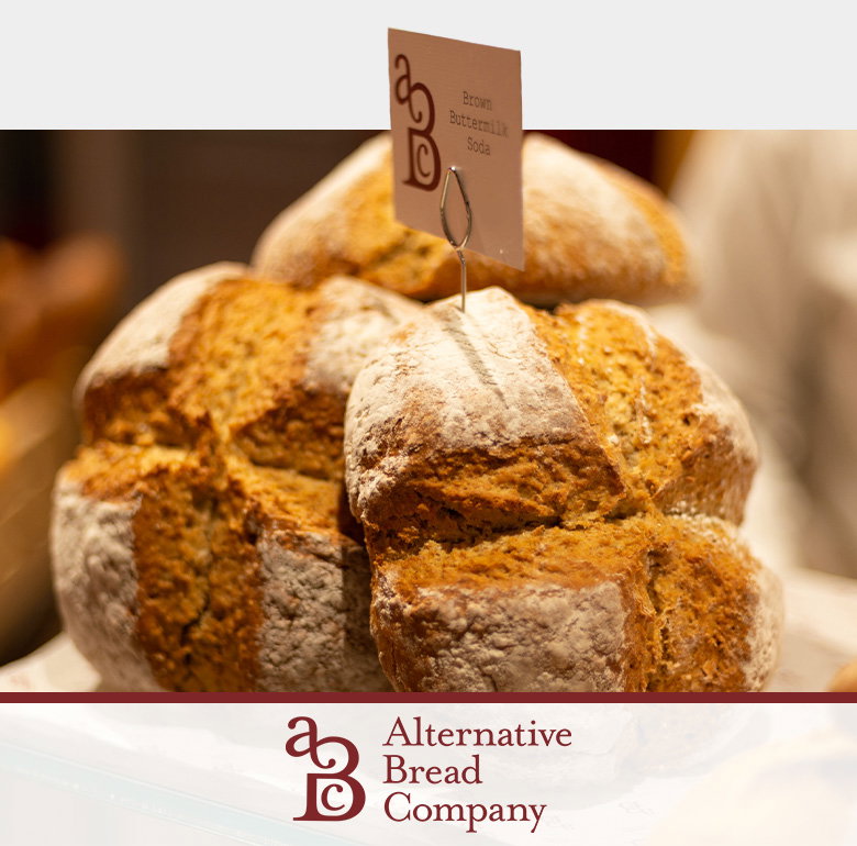 Artisanal brown sourdough bread loaves with rustic crusts and flour dusting