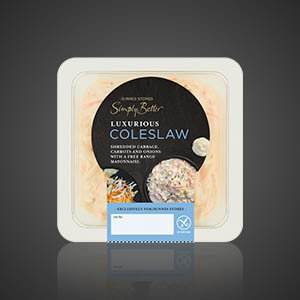 Square tub of Dunnes Stores Simply Better luxurious coleslaw with vintage Cheddar cheese and free-range mayonnaise, on a dark background