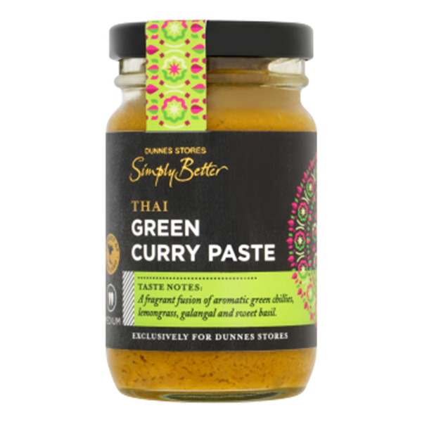 A glass jar of Dunnes Stores Simply Better Thai Green Curry Paste with a black and green label, featuring product details and decorative patterns.