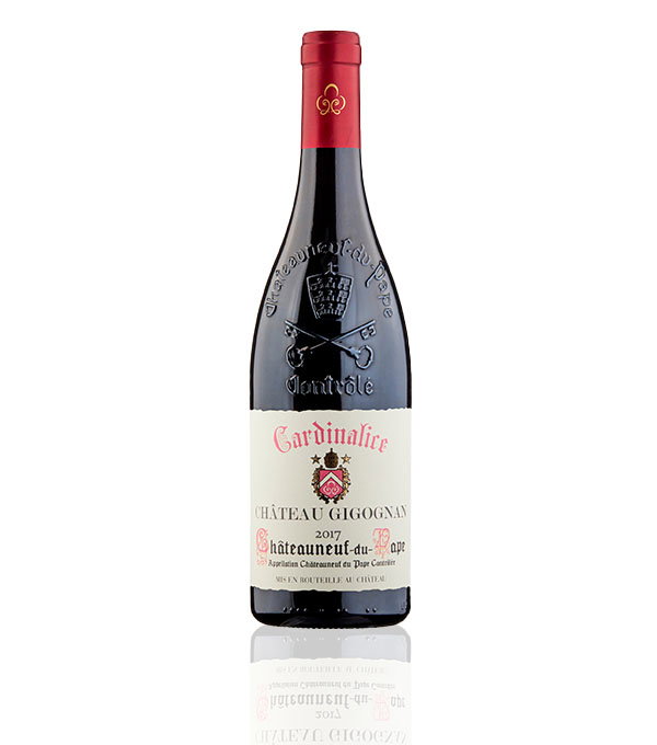 A bottle of 2017 Cardinalice Ch&acirc;teau Gigognan Ch&acirc;teauneuf-du-Pape wine with an embossed emblem on the neck and a cream label adorned with red and gold text.