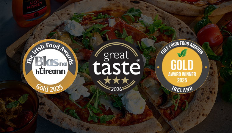 Blas na h&Eacute;ireann, Great Taste and and Free From Food Award logos overlay an image of a gourmet pizza