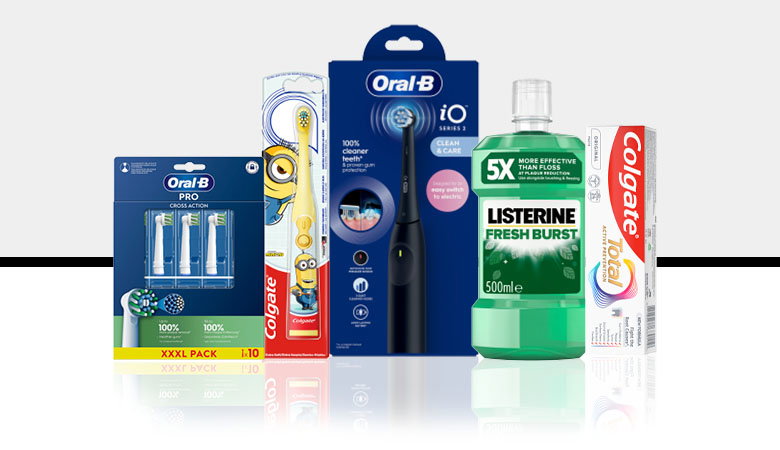 A collection of dental care products including Oral-B toothbrushes, Listerine mouthwash, and Colgate toothpaste, arranged on a white background.
