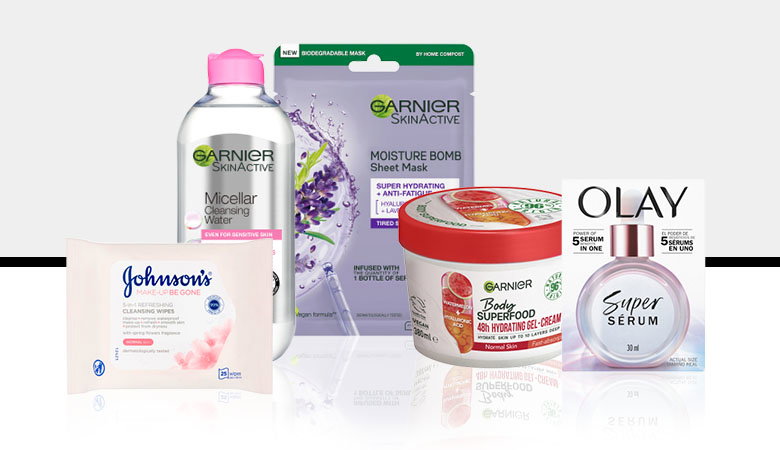 A collection of skincare products including Garnier Micellar Water, sheet mask, moisturising gel, and Olay Super Serum on a white background.