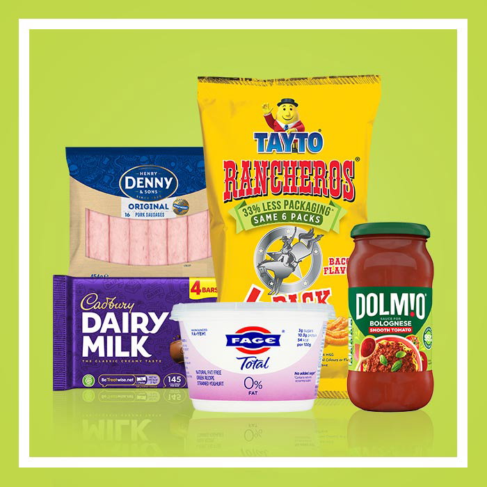 Assorted grocery products on a green background