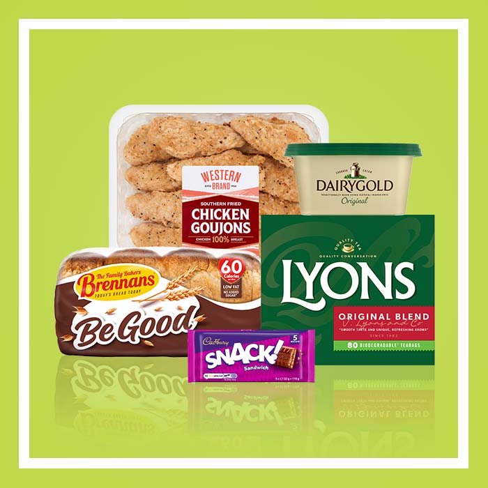 Selection of grocery items on a light green background including Southern Fried chicken goujons, Dairygold butter, Lyons Original Blend tea, Brennan&rsquo;s Be Good sliced bread and a Cadbury Snack chocolate bar