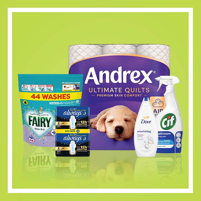 Selection of household and personal care products including Andrex Ultimate Quilts toilet tissue, Fairy Non Bio washing detergent, Always Ultra sanitary towels, Dove Nourishing Care body wash and Cif Bathroom cleaner on a green background