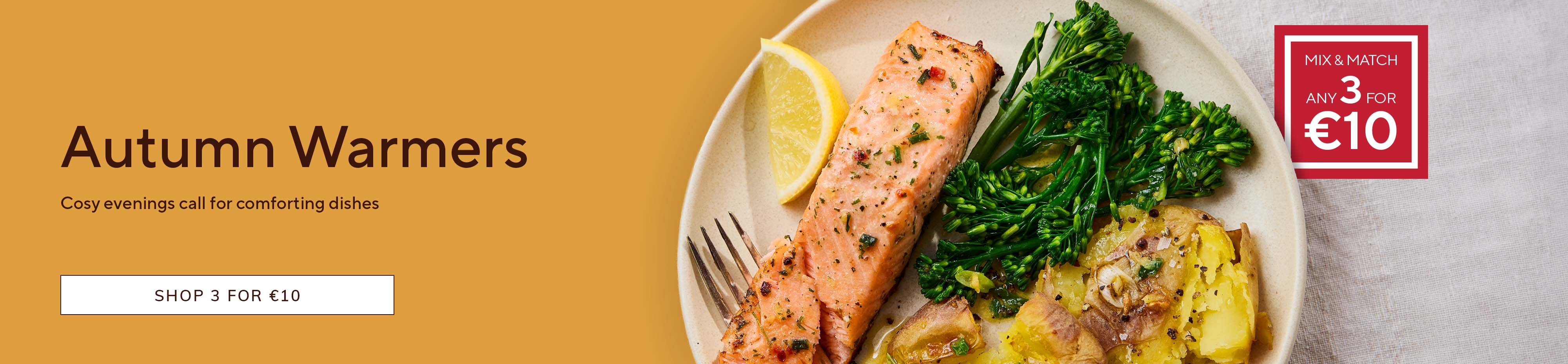 Autumn Warmers promotion featuring a baked salmon fillet served with tenderstem broccoli, roasted potatoes and a lemon wedge, alongside a Mix & Match offer of any 3 products for €10 and a Shop 3 for €10 call-to-action button.