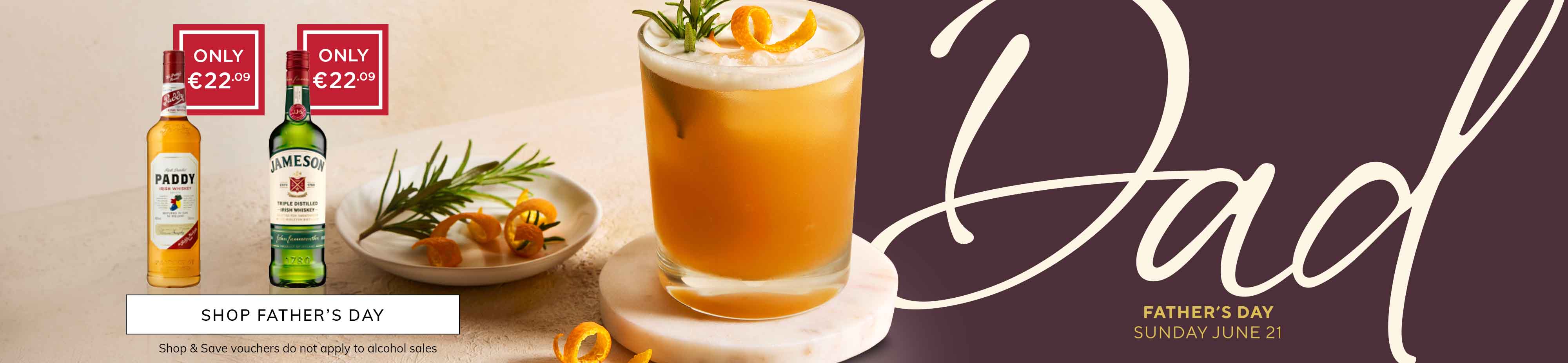 Bottles of Paddy and Jameson whiskey priced €22.09, a whiskey cocktail with orange peel and rosemary, and Father’s Day text on a purple background.