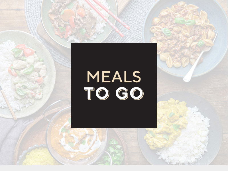 Various prepared meals arranged on plates with 'MEALS TO GO' text overlay on dark background. Visible dishes include salads, rice bowls, and ready-to-eat meal options showcasing convenience food offerings.