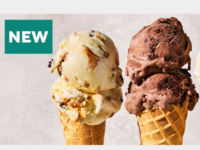 Two waffle ice cream cones against a light background with a teal 'NEW' label. Left cone has vanilla ice cream with caramel swirl and mix-ins, right cone features rich chocolate ice cream with chocolate chips and brownie pieces.