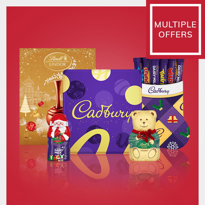 Christmas confectionery gift selection featuring a Cadbury chocolate box, Lindt Lindor advent calendar, Cadbury stocking, Lindt chocolate teddy and chocolate Santa on a red festive background with a "Multiple Offers" promotion sign.