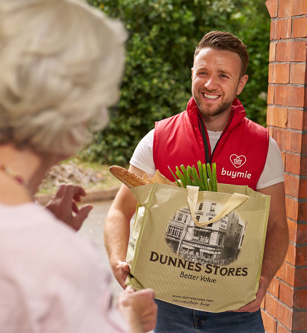 Buymie driver delivering Dunnes Stores groceries
